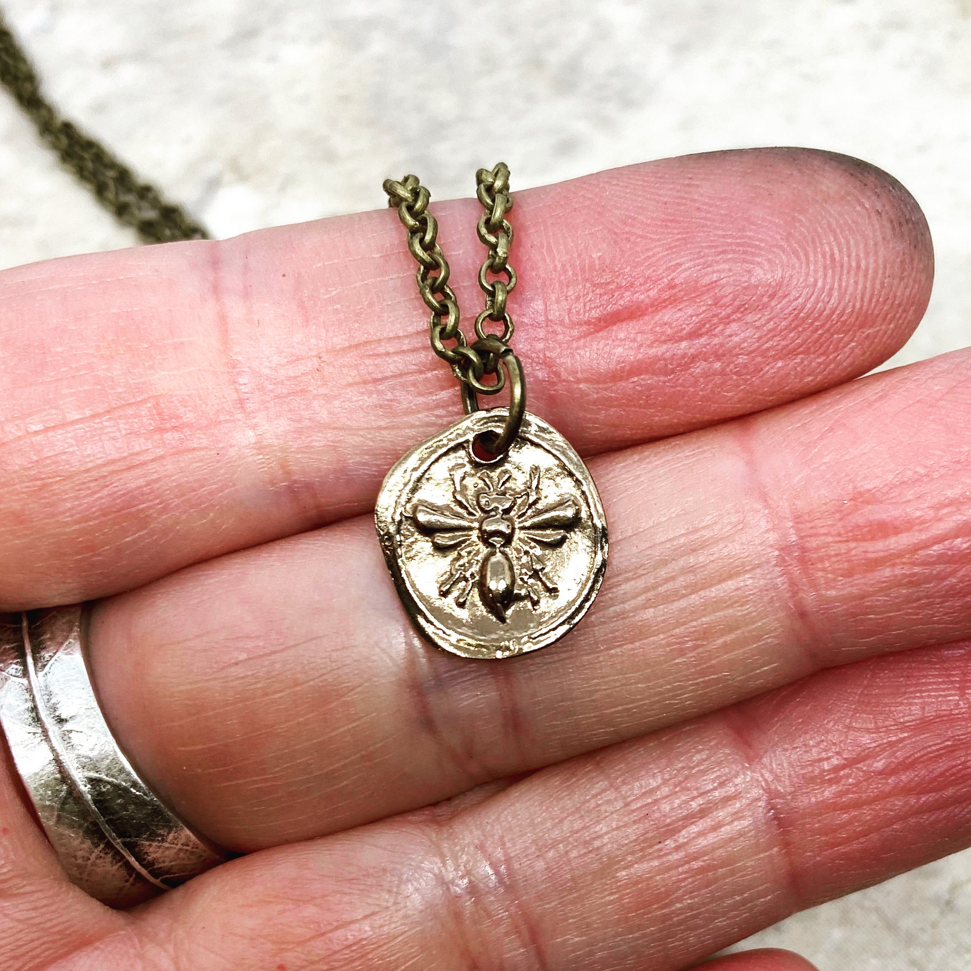 Bee necklace in Bronze